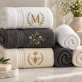 Custom embroidered towels with monogram and decorative stitched designs